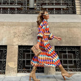 Cassandra - Vibrante Geometrische Kleid